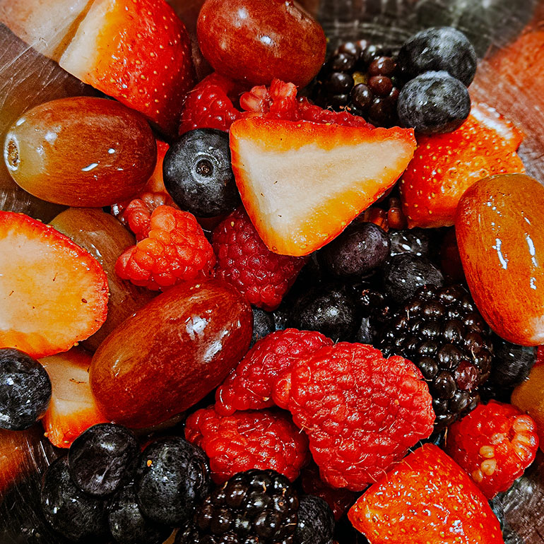 Close-up of fresh berries and grapes, ready to be used in chef-prepared dishes at Aura Independent Living.